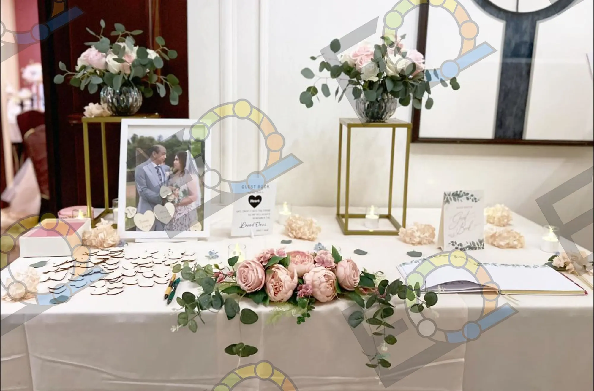 Memory table with framed photograph, candles and soft florals